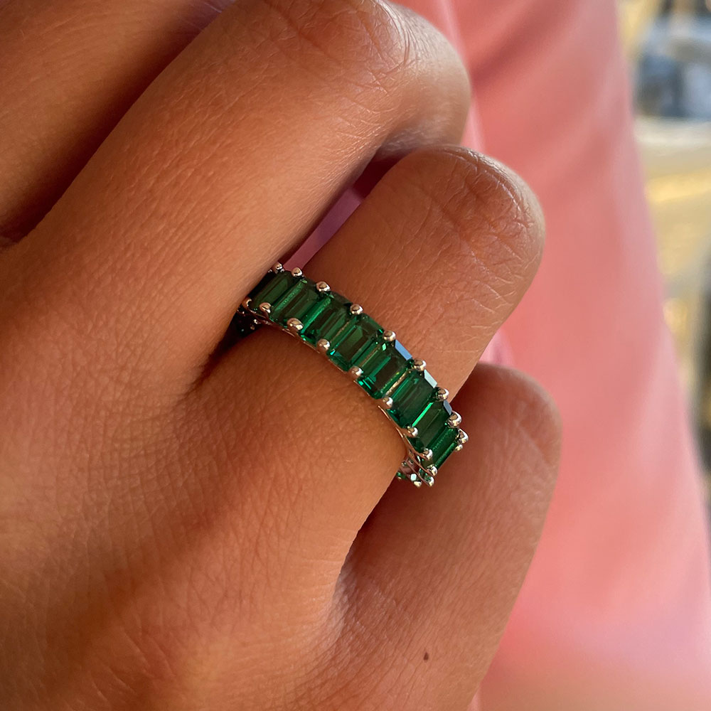 Green emerald clearance eternity band